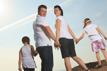 good time family in front of ocean