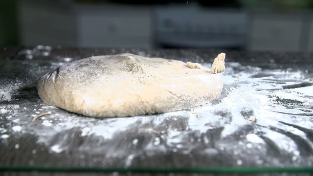Cleaning the dough off the hands in slow motion
