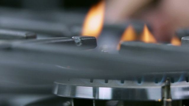 Panning on cooktop fire