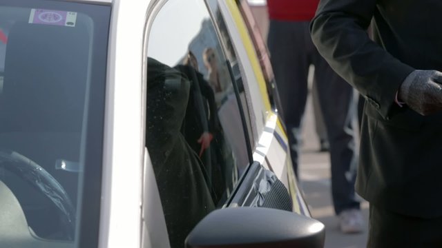 Breaking car side window with a hammer
