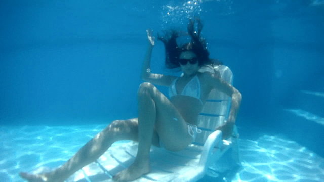 Sitting in the pool. slow motion