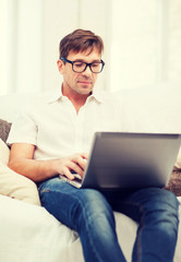 man working with laptop at home