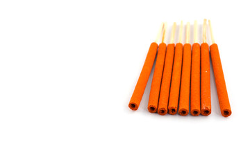 close-ups of incense sticks on white background