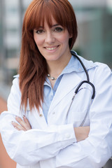 business portrait of smiling young female doctor