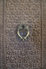 Vintage bronze door handle in Agha Bozorg mosque, Kashan, Iran.