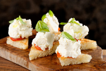 Spanish food tapas. Toasted bread with fresh cheese