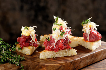 Spanish food tapas. Toasted bread with meat and vegetables