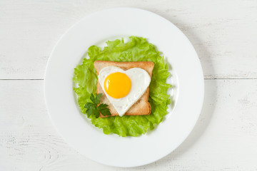 Concept of healthy breakfast - slice of wholewheat toast and egg