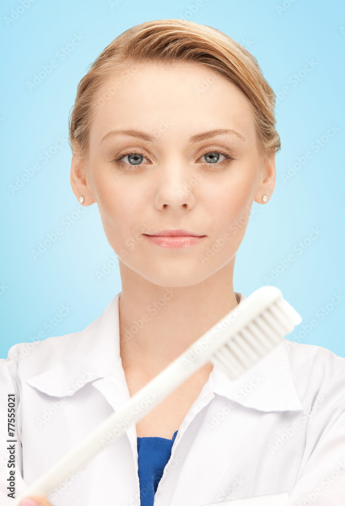 Poster happy young female dentist with tooth brush