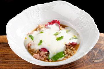 Stew with pearl barley, vegetables, minced meat, herbs