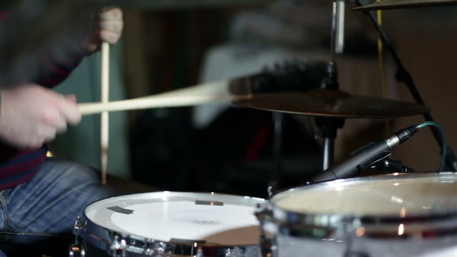 close up shot of musican playing drums
