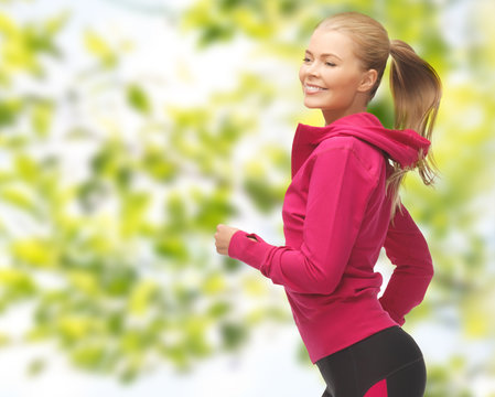 happy woman running or jogging