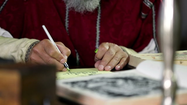 Scholar from 19th century is writing something down