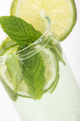 soft drink decorated with lime and mint leaves