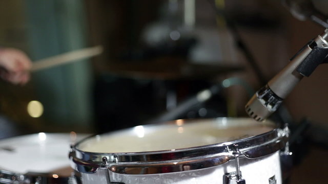 close up shot of musican playing drums