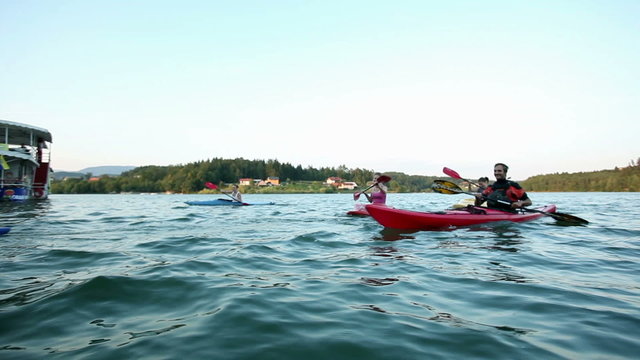 young people while canoeing on the lake