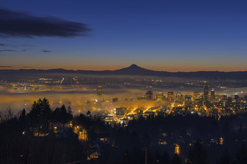 Fog Rolling in at Dawn over the cityscape of Portland
