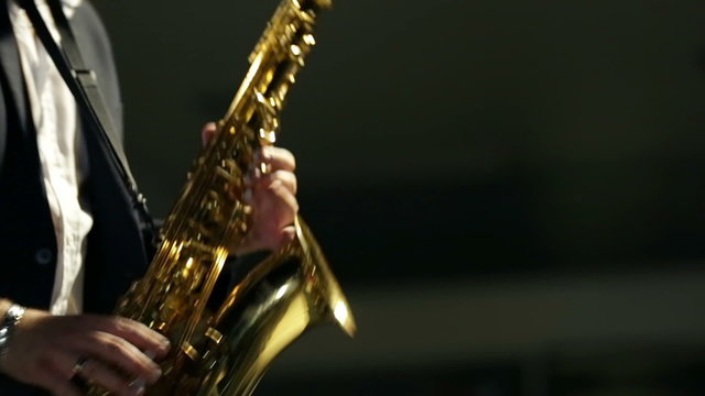 Shot of man intensely playing saxophone 