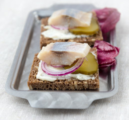 Sandwiches of rye bread with herring