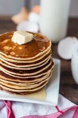 Pancake with butter, honey and milk, sweet breakfast