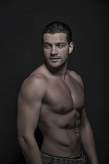 Fototapeta premium Young handsome man with naked torso
