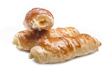 Italian cannoli filled with egg custard on white background
