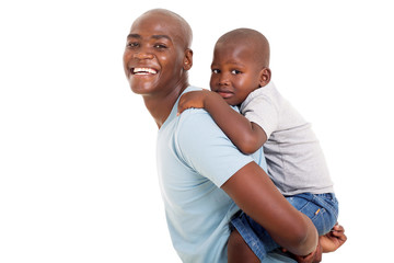young african father carrying his son on his back