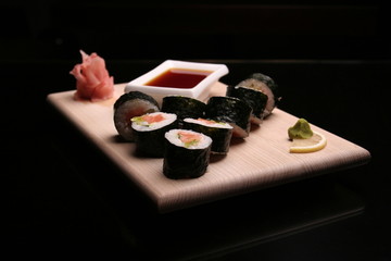 traditional sushi on black background