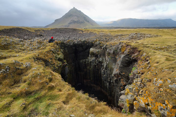 Hole of Basalt formations at Arnarstapi © estivillml