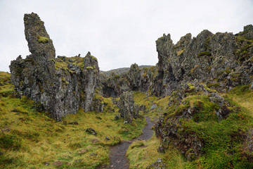 Rock formations in black sand beach of Djupalonssandur