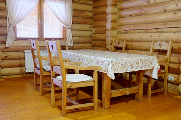 Interior of the dining room in the wooden house
