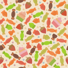 Seamless pattern with colored candies, cupcakes, strawberries an