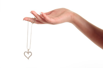 Hand holding the heart isolated on white background