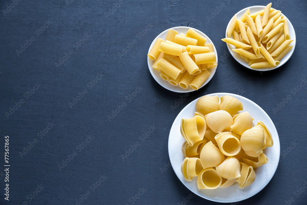 Sticker Various types of pasta on the dark background