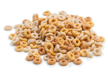 Pile of a lot of round breakfast cereals isolated on white