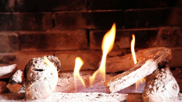 close up fireplace , fire flames in warm fireplace. with space for your text or logo.