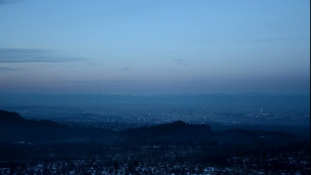 city lights from day to night