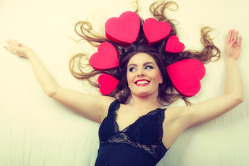 Attractive woman with hearts in hair.