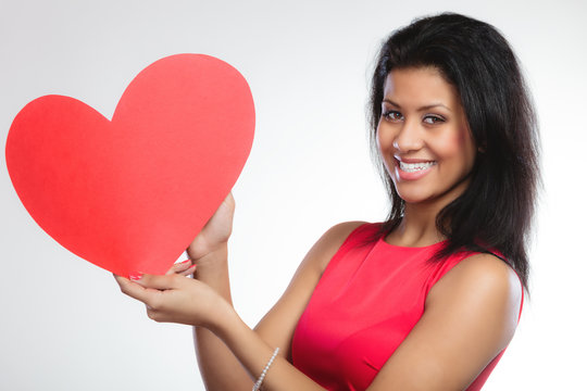 Girl mixed race with paper red heart