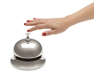 Hand of a woman using hotel bell isolated on white background.
