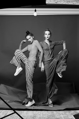Fashion model pose on light background