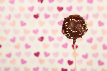 Tasty cake pop on color background