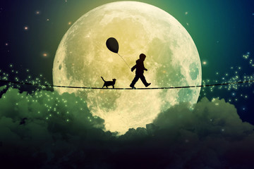 Fototapeta teenager and cat walking with balloon on tight rope above clouds obraz