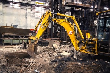 Industrial interior with bulldozer inside