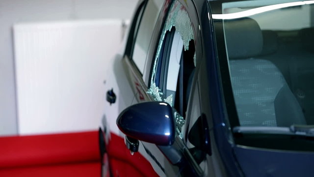 Breaking the car glass with a hammer