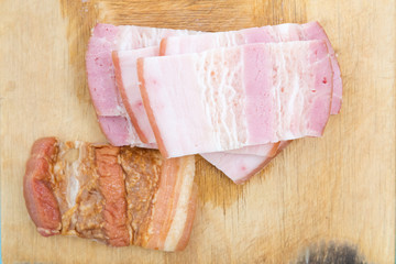 bacon slices on a wooden board