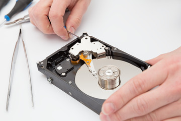 Hard disk without cover and tweezers