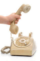 Hand hold vintage telephone cream color