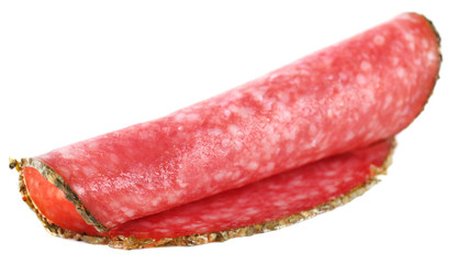 Slice of salami isolated on white background
