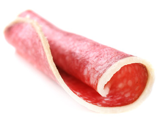 Slice of salami isolated on white background